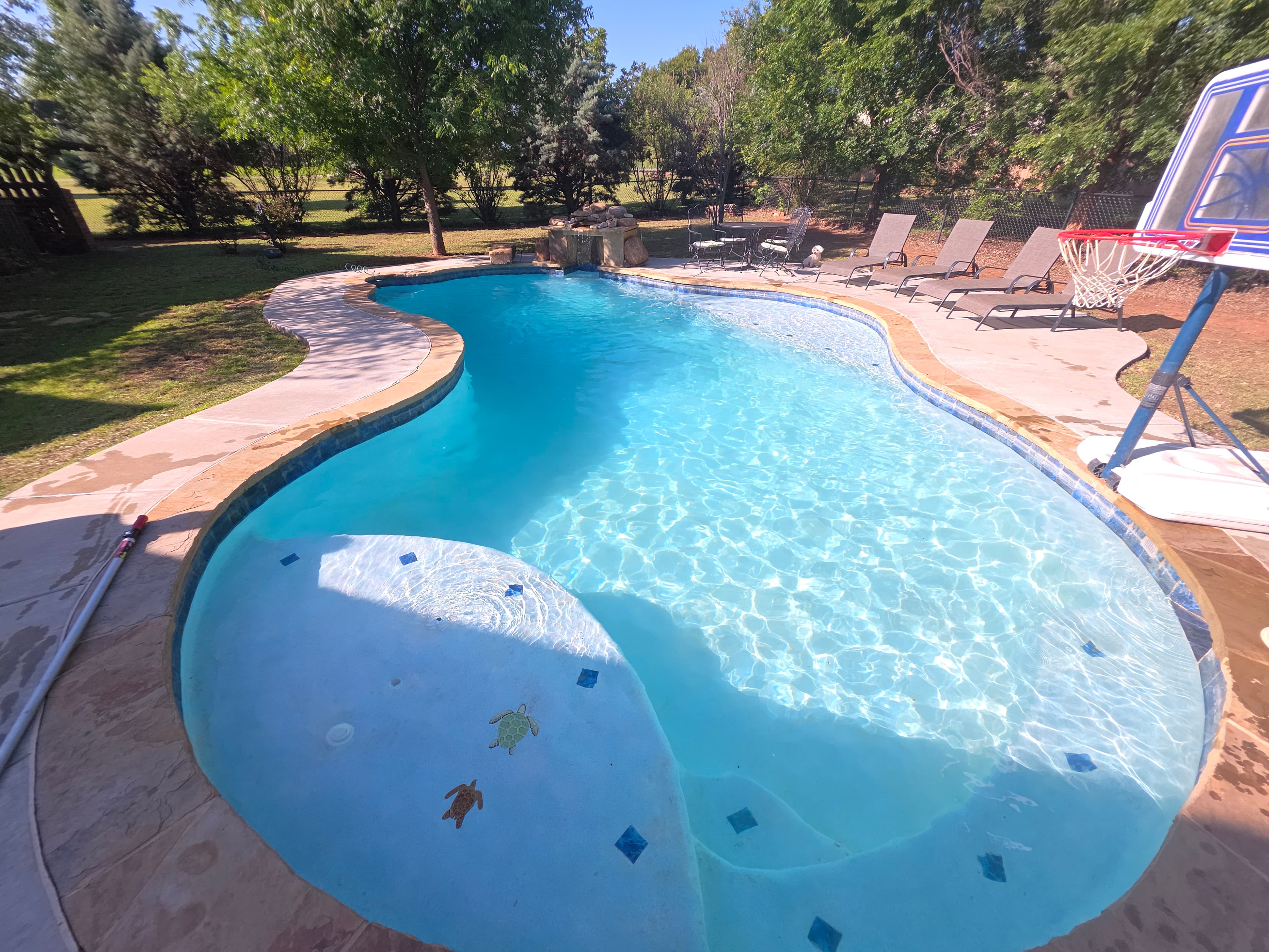 Crystal clear pool restored after a full drain and clean service