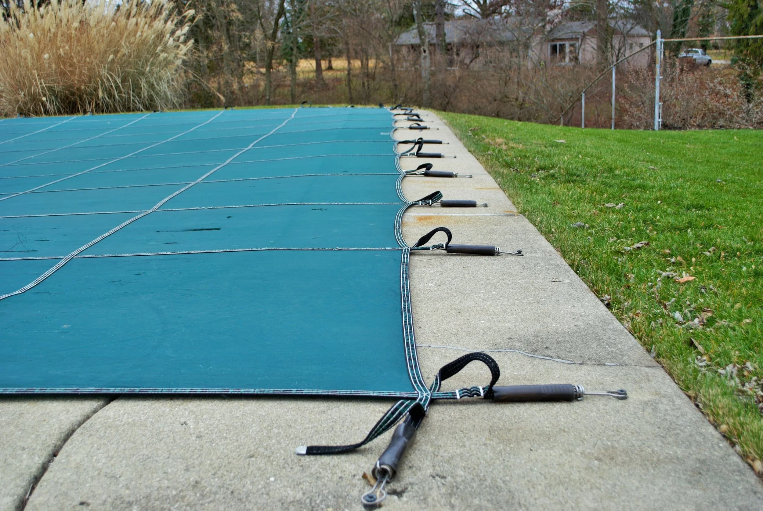 Side-by-side comparison of a swimming pool with green, murky water on the left and clear, blue water on the right.